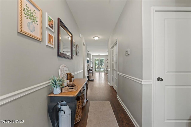 corridor featuring dark hardwood / wood-style flooring