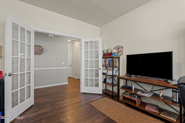 interior space with dark wood-type flooring, french doors, and vaulted ceiling