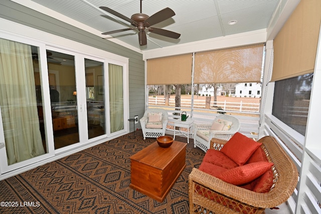 sunroom with a ceiling fan