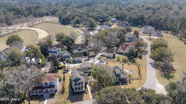 drone / aerial view with a residential view and a forest view