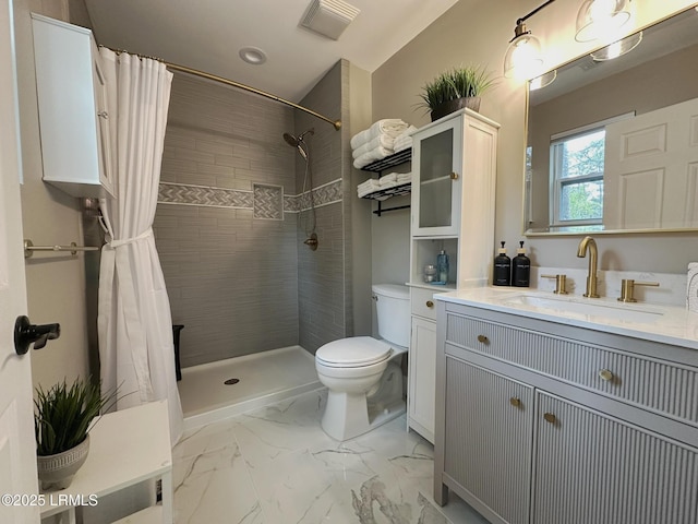 2410 Pine Ct N, Beaufort, SC 29902 - full bath featuring toilet, a tile shower, vanity, and marble finish flooring