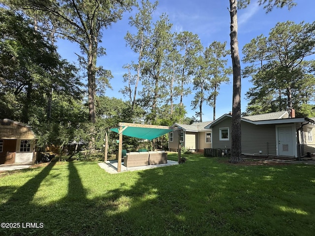 2410 Pine Ct N, Beaufort, SC 29902 - view of grassy yard featuring an outdoor living space and a patio