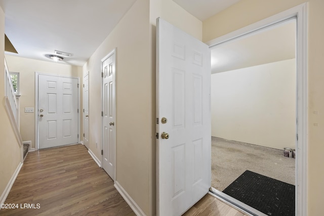 corridor featuring hardwood / wood-style floors