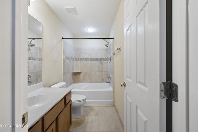 full bathroom with tile patterned floors, vanity, toilet, and tiled shower / bath