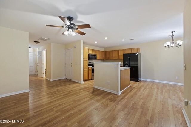 kitchen featuring stainless steel electric stove, a kitchen island, decorative light fixtures, light hardwood / wood-style floors, and black refrigerator with ice dispenser