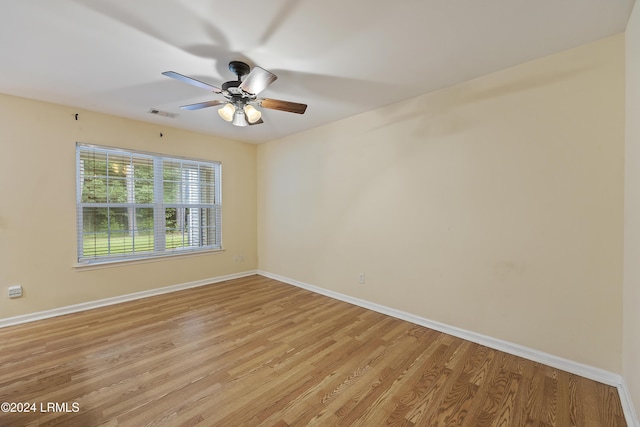 empty room featuring ceiling fan and light wood-type flooring