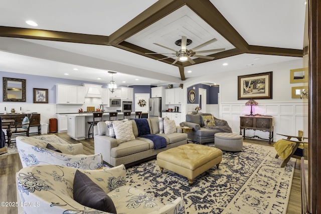 1619 Promenade Ln, Okatie, SC 29909 - living area featuring wood finished floors, arched walkways, a wainscoted wall, recessed lighting, and a ceiling fan