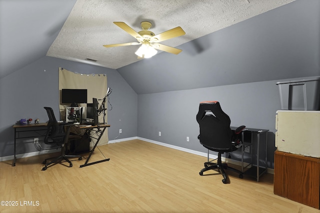 93 Heartstone Cir, Bluffton, SC 29910 - office with wood finished floors, ceiling fan, baseboards, lofted ceiling, and a textured ceiling