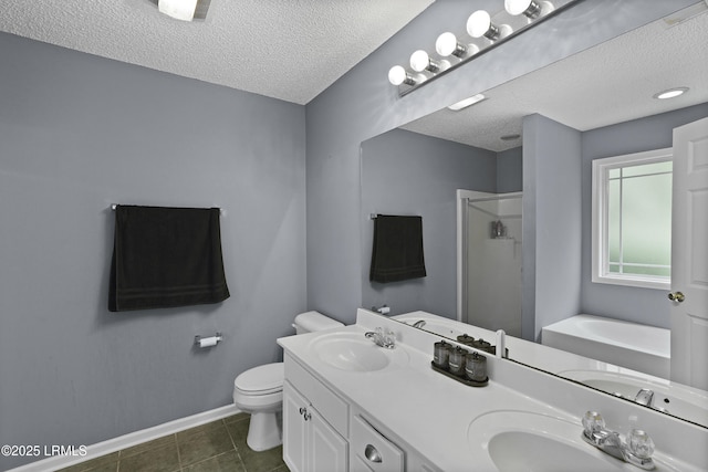 93 Heartstone Cir, Bluffton, SC 29910 - bathroom with a shower stall, a textured ceiling, a garden tub, double vanity, and toilet