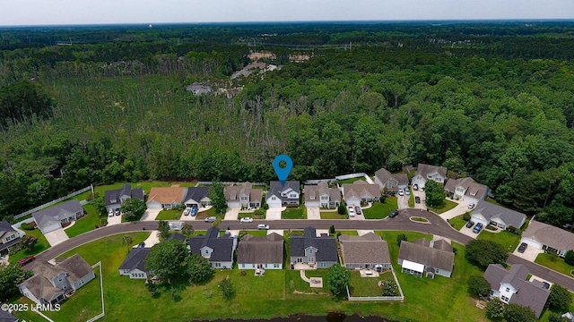 93 Heartstone Cir, Bluffton, SC 29910 - aerial view of property and surrounding area featuring a forest and nearby suburban area