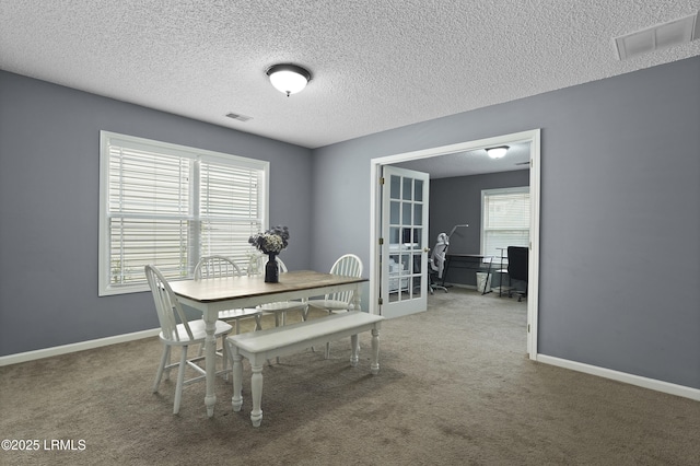 93 Heartstone Cir, Bluffton, SC 29910 - carpeted dining room with an office area, baseboards, and a textured ceiling