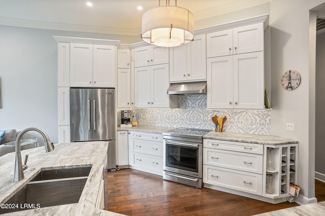 kitchen with sink, light stone counters, white cabinetry, hanging light fixtures, and appliances with stainless steel finishes