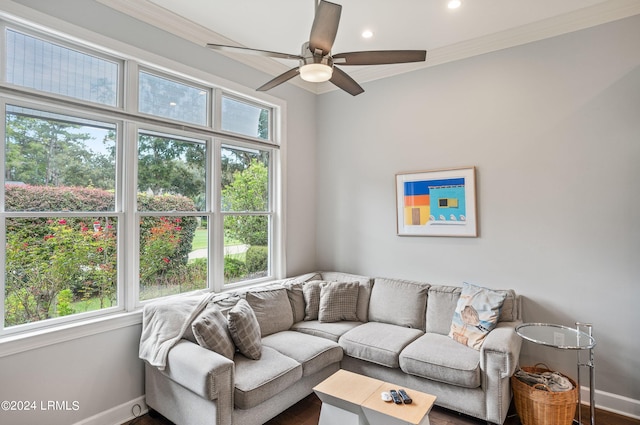 living room featuring ceiling fan, crown molding, and a healthy amount of sunlight