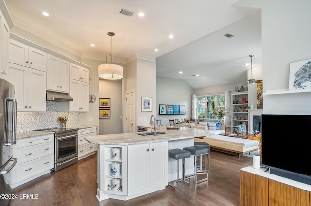 kitchen with appliances with stainless steel finishes, decorative light fixtures, tasteful backsplash, white cabinetry, and sink