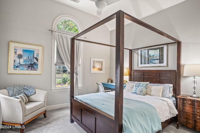 bedroom featuring lofted ceiling, light carpet, and ceiling fan