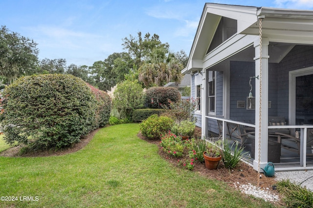 view of yard with a sunroom