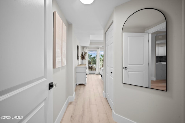 21 S Forest Beach Dr Unit 235, Hilton Head Island, SC 29928 - hallway featuring baseboards and light wood-style floors