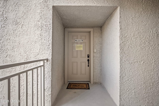 21 S Forest Beach Dr Unit 235, Hilton Head Island, SC 29928 - property entrance featuring stucco siding and a balcony