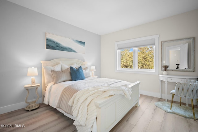 21 S Forest Beach Dr Unit 235, Hilton Head Island, SC 29928 - bedroom featuring light wood finished floors and baseboards