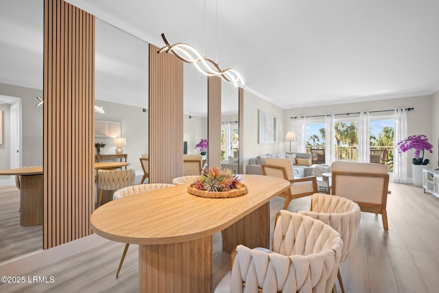 21 S Forest Beach Dr Unit 235, Hilton Head Island, SC 29928 - dining space with ornamental molding, light wood-type flooring, and ornate columns