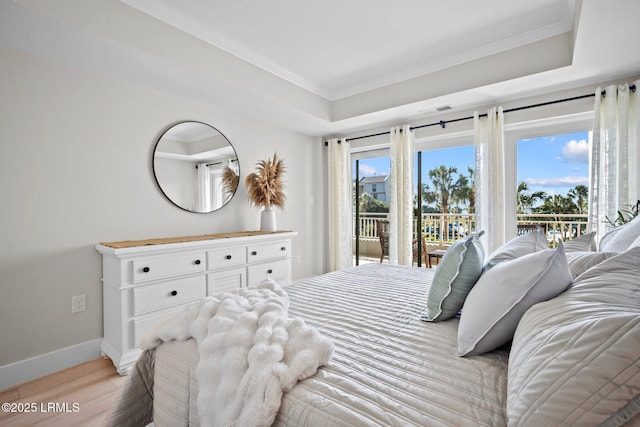 21 S Forest Beach Dr Unit 235, Hilton Head Island, SC 29928 - bedroom featuring crown molding, baseboards, light wood finished floors, and access to exterior