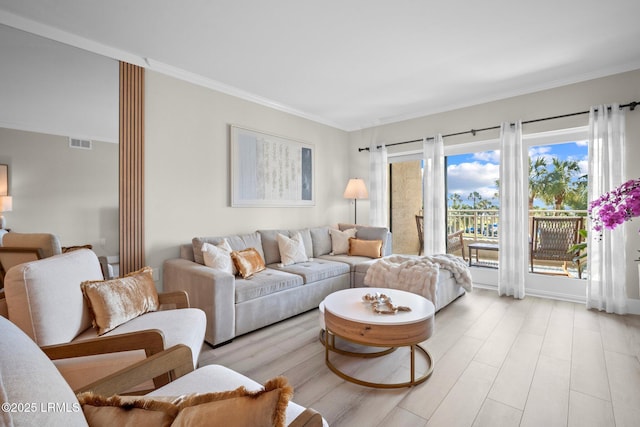 21 S Forest Beach Dr Unit 235, Hilton Head Island, SC 29928 - living area with ornamental molding, light wood-type flooring, and visible vents