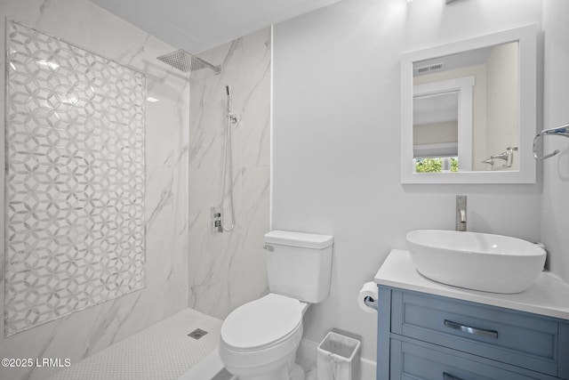 21 S Forest Beach Dr Unit 235, Hilton Head Island, SC 29928 - bathroom with a marble finish shower, toilet, vanity, and visible vents
