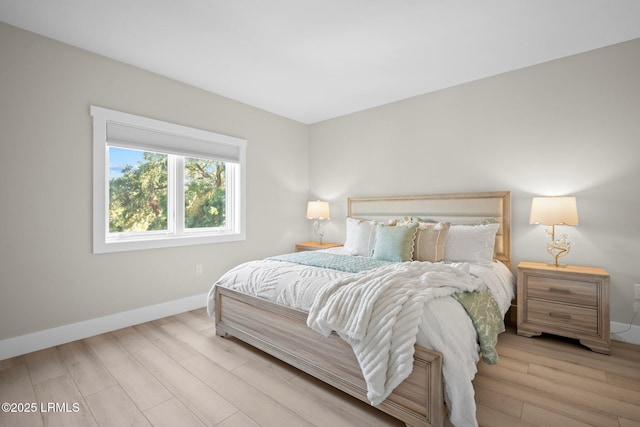 21 S Forest Beach Dr Unit 235, Hilton Head Island, SC 29928 - bedroom featuring wood finished floors and baseboards