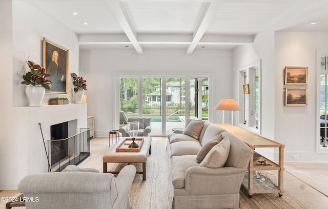 living room with coffered ceiling, beam ceiling, and light wood-type flooring