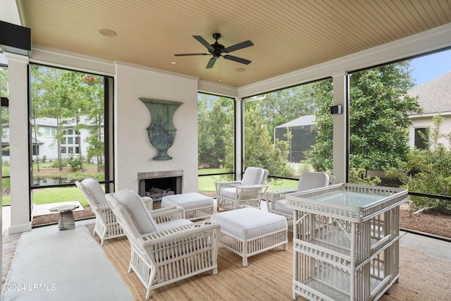 sunroom / solarium featuring wooden ceiling and ceiling fan