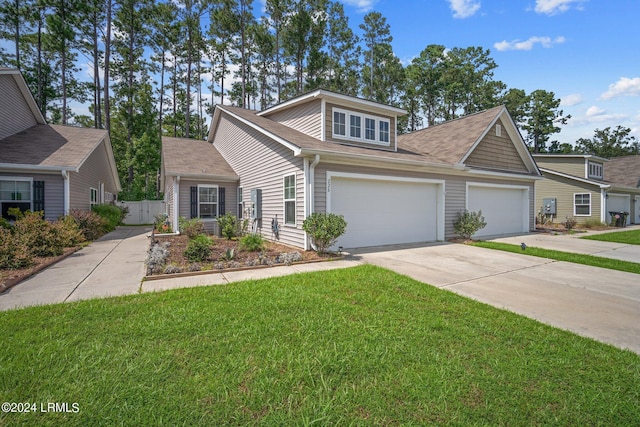 view of front of property with a garage and a front lawn