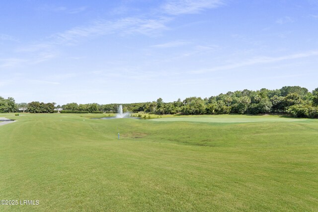 127 Kings Creek Dr, Bluffton, SC 29909 - view of property's community featuring golf course view, a lawn, view of scattered trees, and a water view