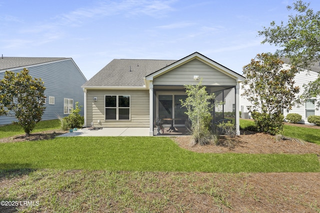127 Kings Creek Dr, Bluffton, SC 29909 - back of house featuring a yard, a sunroom, a patio area, and roof with shingles
