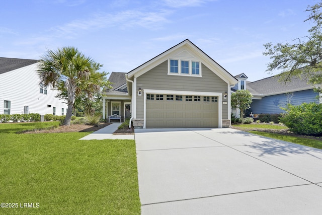127 Kings Creek Dr, Bluffton, SC 29909 - view of front of house with driveway, a front lawn, a garage, and stone siding