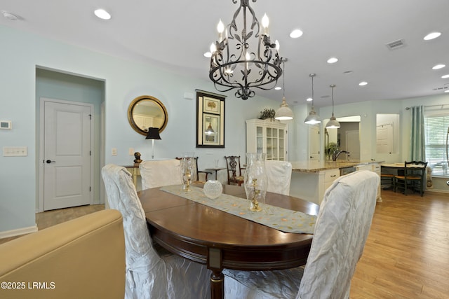 127 Kings Creek Dr, Bluffton, SC 29909 - dining room featuring recessed lighting, light wood finished floors, a chandelier, and baseboards