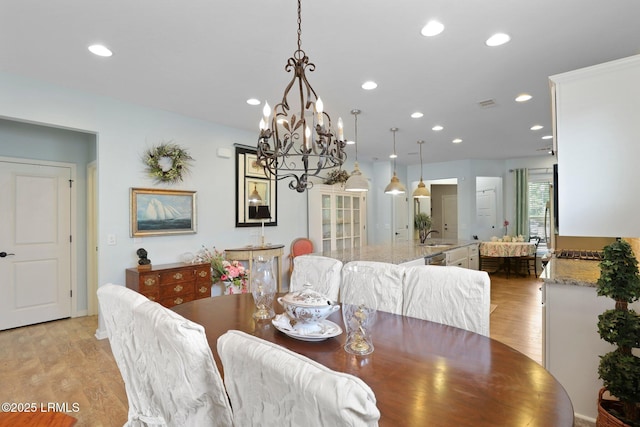 127 Kings Creek Dr, Bluffton, SC 29909 - dining area featuring a chandelier, light wood-type flooring, and recessed lighting