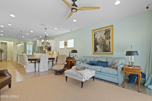 127 Kings Creek Dr, Bluffton, SC 29909 - living area with recessed lighting, light wood finished floors, a ceiling fan, and a chandelier