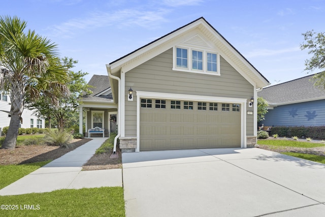 127 Kings Creek Dr, Bluffton, SC 29909 - view of front of home featuring stone siding, a garage, and driveway