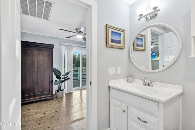 bathroom with vanity, hardwood / wood-style floors, and ceiling fan