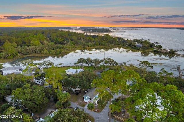 aerial view at dusk with a water view