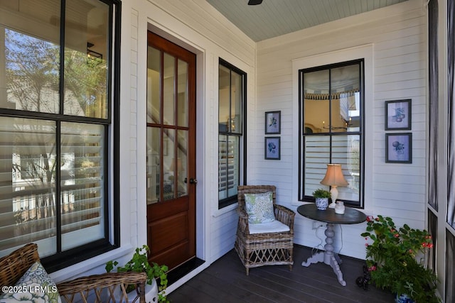 view of exterior entry with covered porch