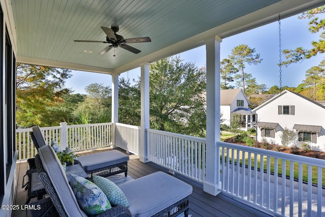 wooden deck featuring ceiling fan