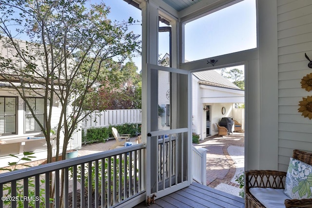 wooden terrace featuring fence