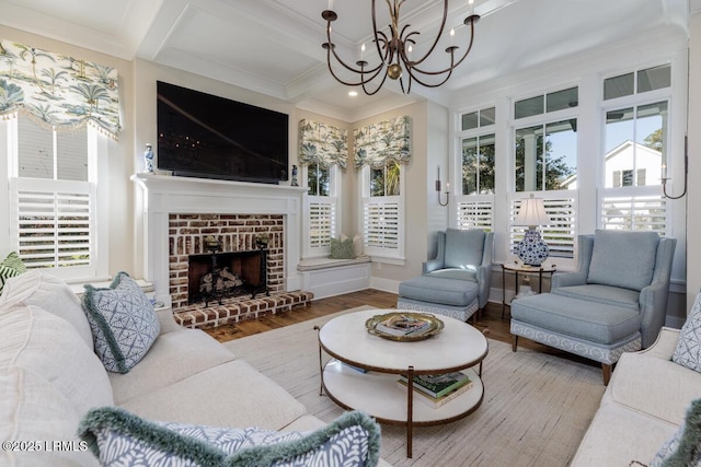 living area featuring crown molding, a brick fireplace, wood finished floors, coffered ceiling, and beamed ceiling