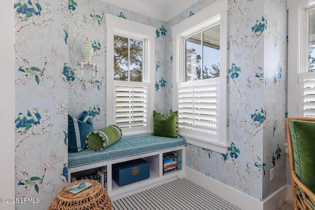 mudroom featuring wallpapered walls, plenty of natural light, and baseboards