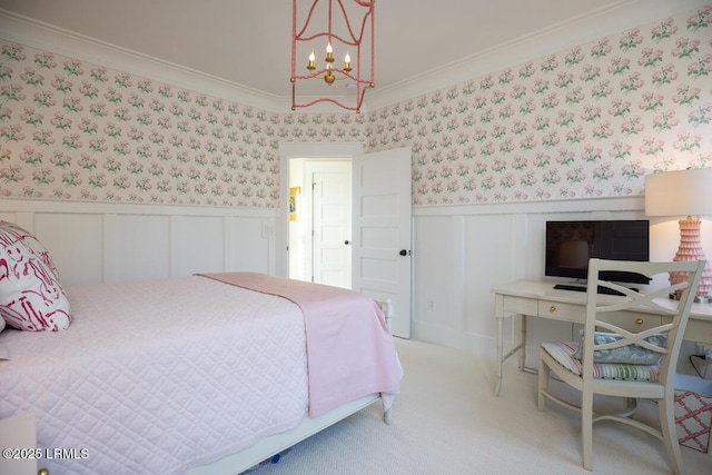 bedroom with a chandelier, light colored carpet, a wainscoted wall, wallpapered walls, and crown molding