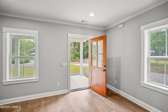 9 Attaway Ln, Beaufort, SC 29907 - entryway featuring plenty of natural light, baseboards, wood finished floors, ornamental molding, and recessed lighting