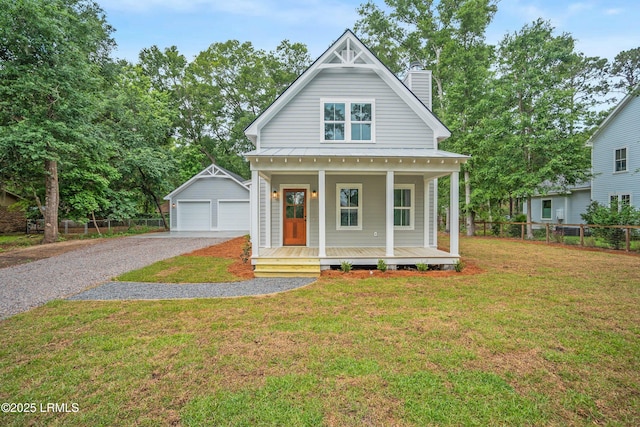 9 Attaway Ln, Beaufort, SC 29907 - view of front of property featuring an outbuilding, a chimney, a porch, a garage, and metal roof