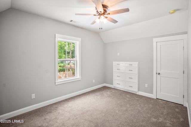 9 Attaway Ln, Beaufort, SC 29907 - unfurnished bedroom featuring lofted ceiling, carpet, baseboards, and ceiling fan