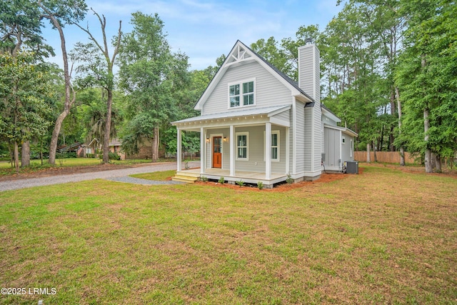 9 Attaway Ln, Beaufort, SC 29907 - view of front facade featuring cooling unit, a chimney, and a porch